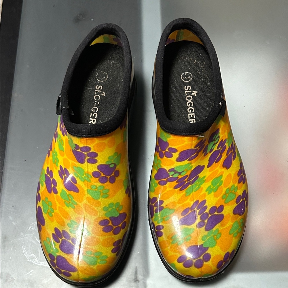 Sloggers Vibrant Yellow Clogs with Purple and Green Paw Prints